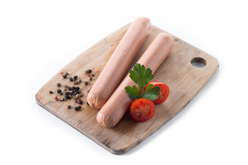 Raw Frankfurt sausages with cherry tomatoes and parsley isolated on white background