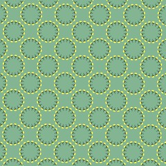 A seamless circular floral pattern with soft green background. Yellow petal-like motifs arranged in round shapes, creating a decorative and elegant textile-inspired design.