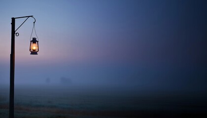 Old-fashioned lantern hang from elegant wooden pole,soft glow of dawn on horizon,copy space.