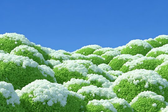 Green stylized hills covered in white on a sunny blue sky background.