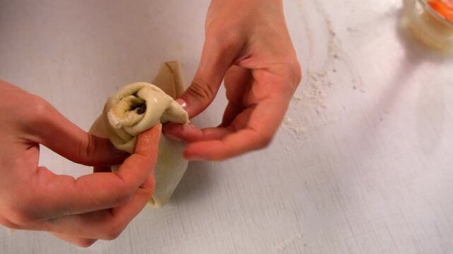 Pastry chef woman cooking dessert wrapping filled pear in dough on kitchen. Create delicious healthy food pastry. Cuisine culinary prepare homemade cook domestic meal baking recipe ingredients.