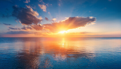 Fototapeta premium A Surreal Dreamy Seascape With A Vibrant Sunset Reflecting On A Calm Ocean