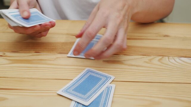 hands deal playing cards before the game. gambling. A board game for spending leisure time with friends and family.