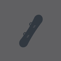 Dark snowboard silhouette on gray background ready for winter sports and recreation.