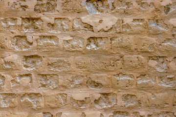 The unique texture of a section of the weathered adobe wall of a farm house, in the eastern Andean mountains of central Colombia, near the town of Villa de Leyva.