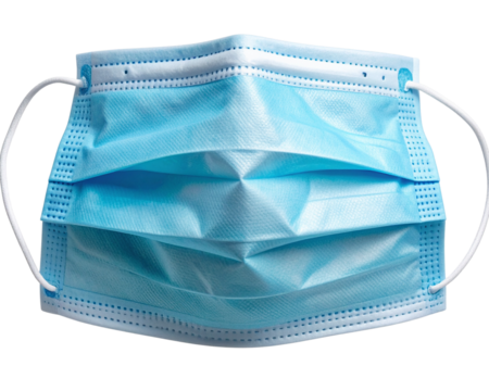 A slightly wrinkled and naturally curved light blue surgical face mask lying flat wit 