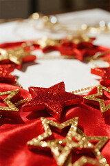 Red curtains on the stage. Satin. Close-up. gold stars.