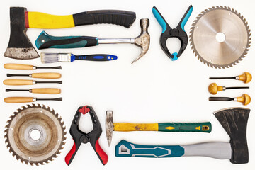 Flat lay of new and used hand tools on white background. Large collection of various tools and bits arranged on white.