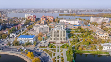 Lukoil office building in Astrakhan, Russia, with business center, park, Volga River, autumn...