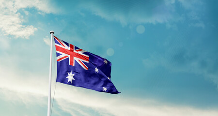 Australia national flag fluttering. The flag blowing in beautiful soft sky. Australia national flag...
