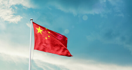 China national flag fluttering. The flag blowing in beautiful soft sky. China national flag for independence day.