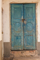Old weathered wooden door of an abandoned farmhouse, in the high of the mountains near the village of Cucaita, in the eastern Andes of central Colombia.