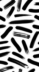 Fototapeta premium Black brushstrokes on a white background, creating a dynamic and abstract pattern.