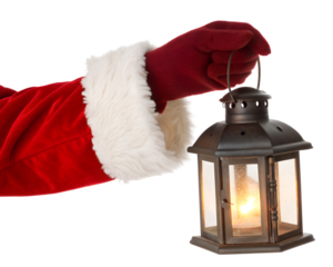 A gloved hand in a red Santa Claus costume holds a vintage lantern. The lantern is lit, casting a warm glow. The background is transparent and isolated.