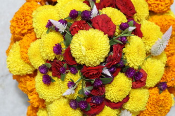 colorful flowers stacked up to create bathukamma, a specific hindu god worshiped in south india