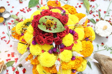 colorful flowers stacked up to create bathukamma, a specific hindu god worshiped in south india