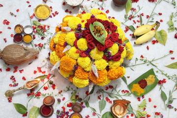 colorful flowers stacked up to create bathukamma, a specific hindu god worshiped in south india