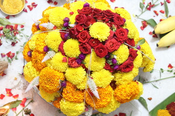 colorful flowers stacked up to create bathukamma, a specific hindu god worshiped in south india