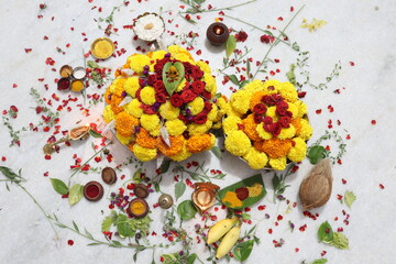 colorful flowers stacked up to create bathukamma, a specific hindu god worshiped in south india