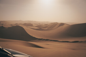 Expansive sand dunes surrounding Huacachina Oasis near Ica, Peru.