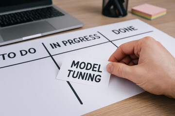 Obraz premium AI developer workspace with programmer organizing model tuning task on project board showing progress and completion in focused environment