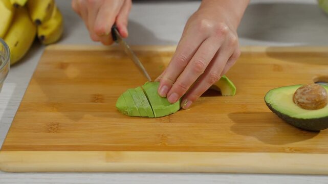 Cutting and preparing fruits and vegetables in the kitchen.