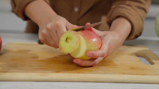 Cutting and preparing fruits and vegetables in the kitchen.
