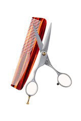Hair cutting scissors and comb isolated on a white background.