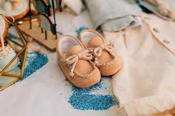 Baby Boy Christening Shoes and Outfit Display

