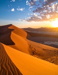 Sunrise over orange dunes