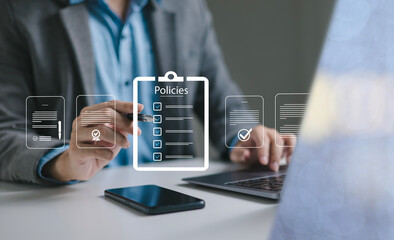 Businessman reviews company policies, digital documents, ideal for policy management, business compliance, document approval, and corporate governance visualization.