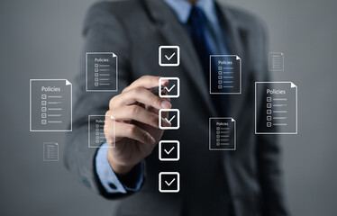 Businessman reviews company policies, digital documents, ideal for policy management, business compliance, document approval, and corporate governance visualization.