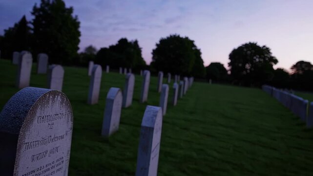 Peaceful cemetry at dusk with white lilies in bloom
