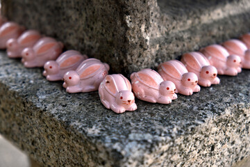 Pink Ceramic Rabbit Statues on a Stone Lantern Pedestal (Japanese Shrine, Zodiac, Cute)