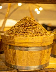 Wooden bowl filled with dried spices
