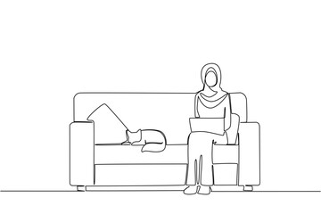 Single one line drawing arab woman sitting on sofa typing and holding laptop on lap and cat lying down. Work very comfortably. National Work From Home Day. Continuous line design graphic illustration