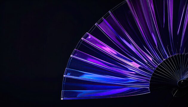 Clear handheld fan lit with purple and blue neon on a dark stage for promotion use