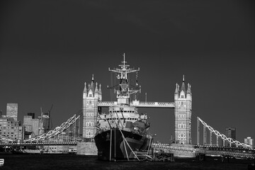 View over the warship and Tower Bridge monochrome © Andreea_Prodan