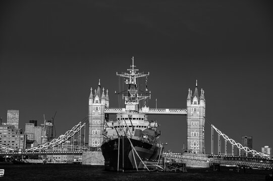 View over the warship and Tower Bridge monochrome
