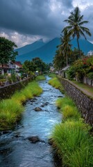 Fototapeta premium River flows through a village, with mountains in the background under a cloudy sky