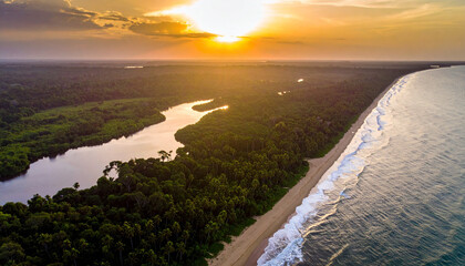 Sunset over Gabon�s Loango National Park with sandy beaches meeting a dense tropical forest.