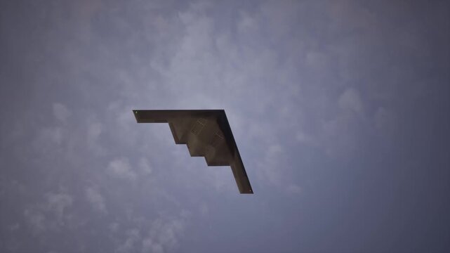 Stealth Bomber Flying At Sunset