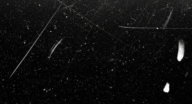 Black scratched surface with dust and noise creates a vintage effect - Powered by Adobe