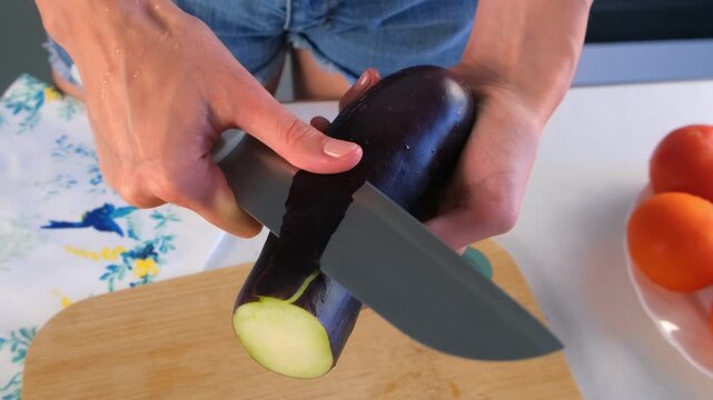 Chef woman hands cooking skillfully peeling eggplant on wooden cutting board. Culinary skills techniques, homemade preparing healthy meal, cook domestic food vegetable dish, cuisine, fresh ingredient.