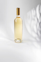 White Wine bottle mockup with golden cap, showcasing elegant design and smooth glass texture, perfect for branding and marketing purposes with copy space