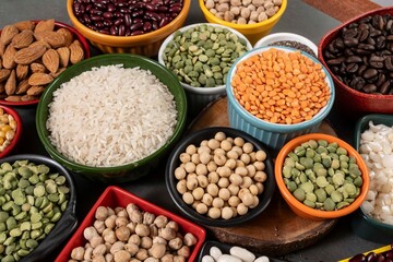 several pots with raw grains for preparing healthy food
