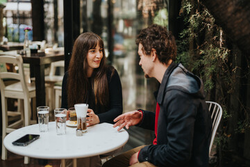 A casual meeting between two individuals enjoying a friendly conversation at a coffee shop. The serene atmosphere highlights their engagement and interaction.