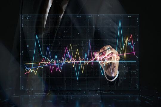 Guiding Growth: Business Professional Interacting with Luminous Market Trends diagrams. Financial Concept