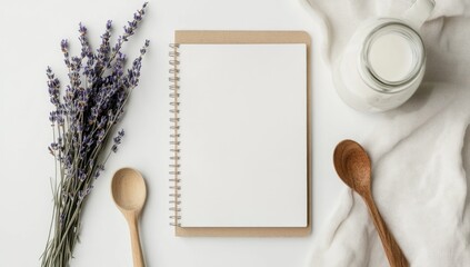 Blank recipe book, lavender, milk, spoons