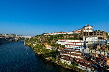 Panoramic view of Serra do Pilar Monastery and hillside buildings along the Douro River in Vila Nova de Gaia, Porto, Portugal.